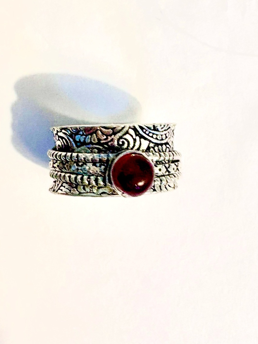 Beautiful, 3 silver bands, spin ring, with a Garnet in the center, size 8 1/2